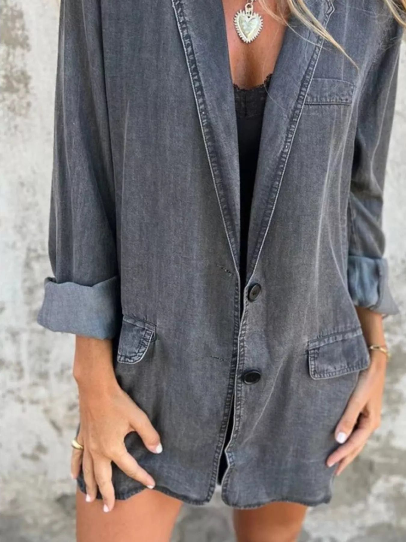 Denim jacket worn by a person with a neutral background